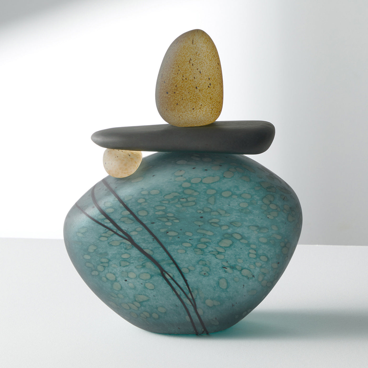large cairn in teal