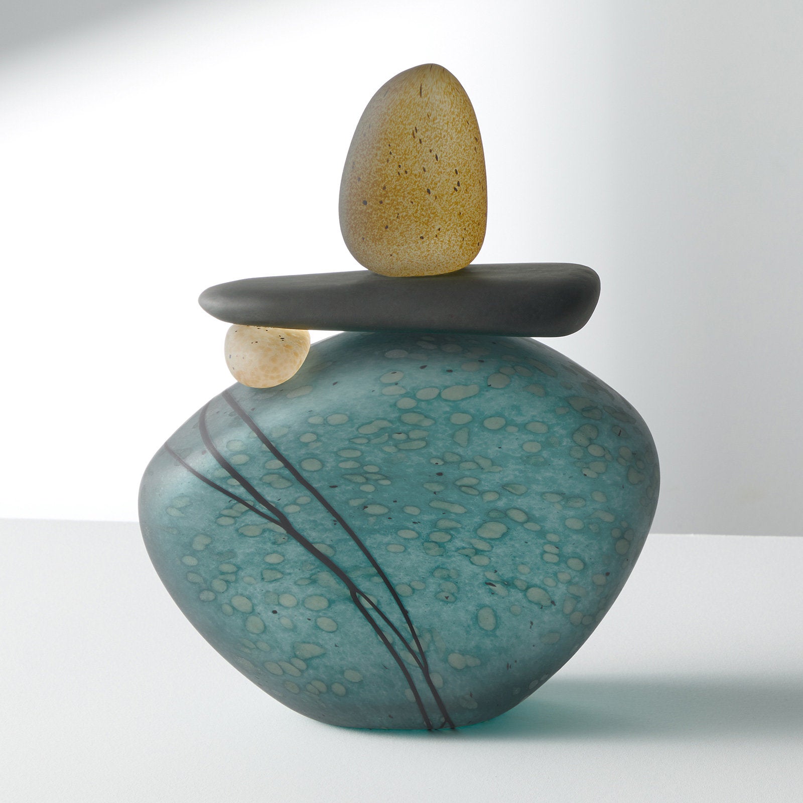large cairn in teal