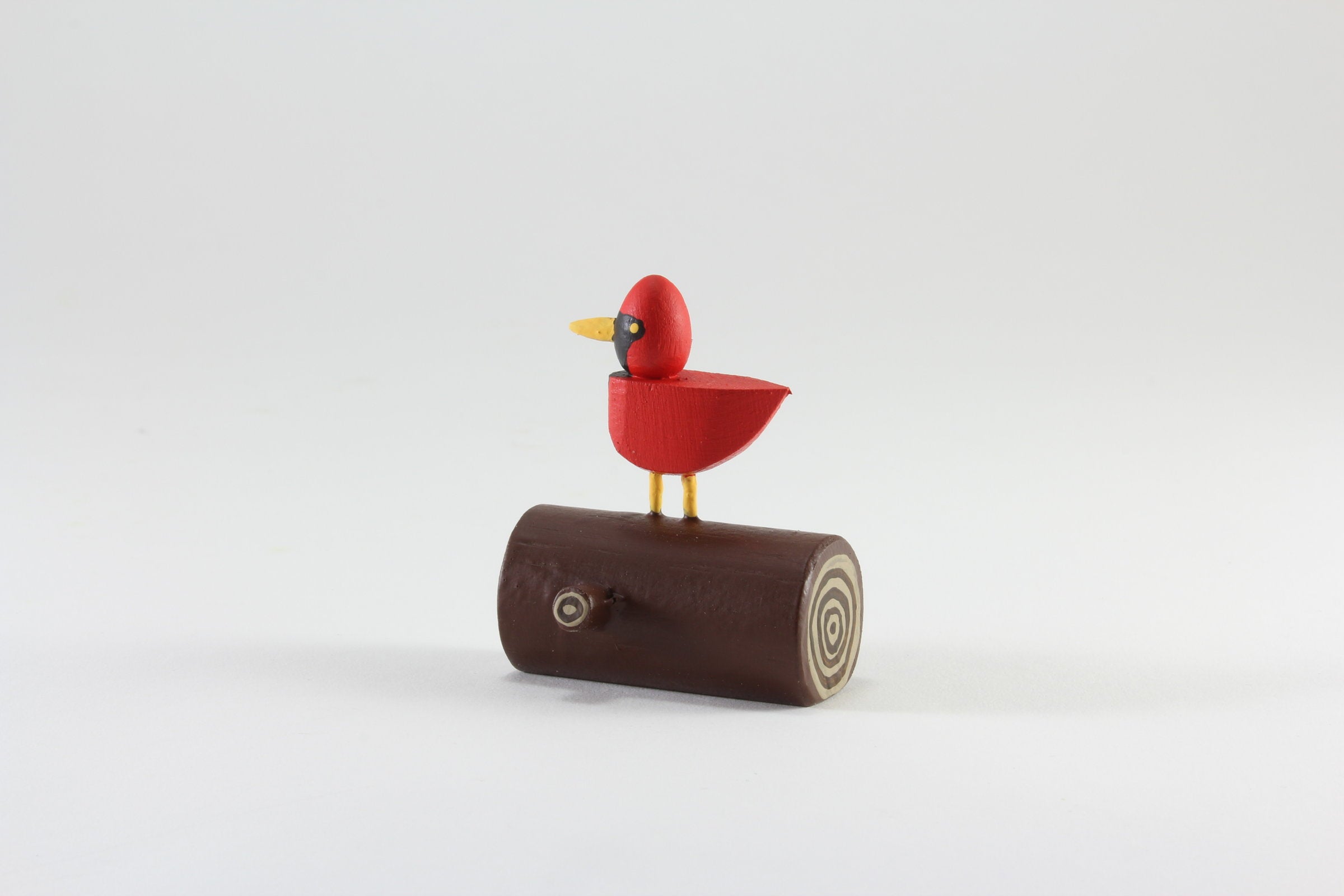 cardinal on a log